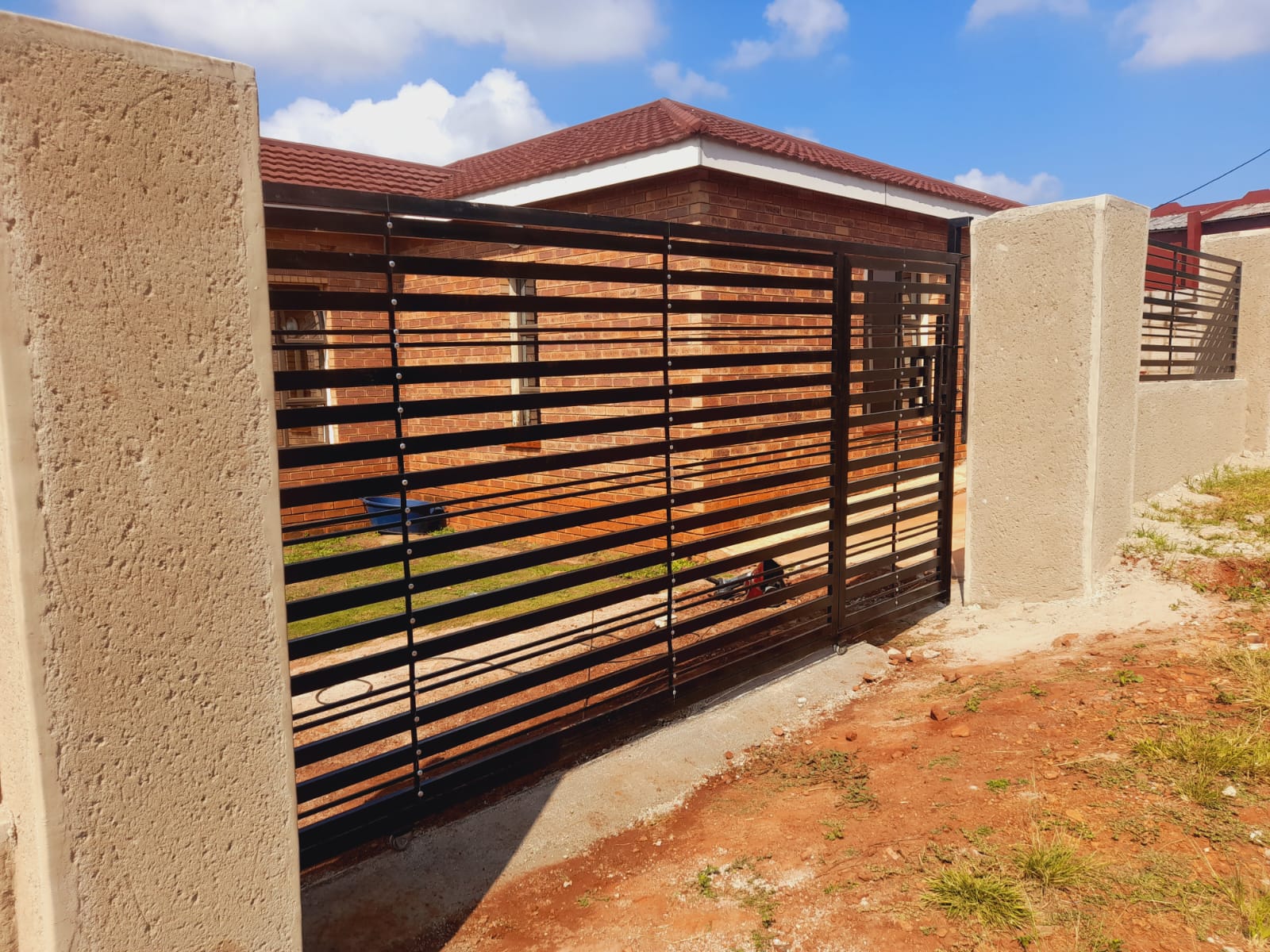 Horizontal bar sliding gate open view
