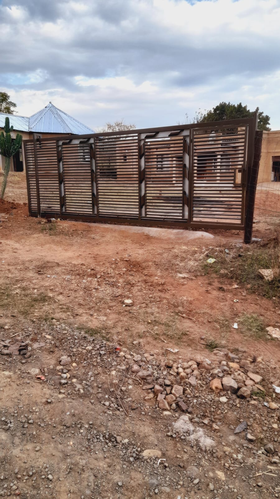 Large brown louvre sliding gate