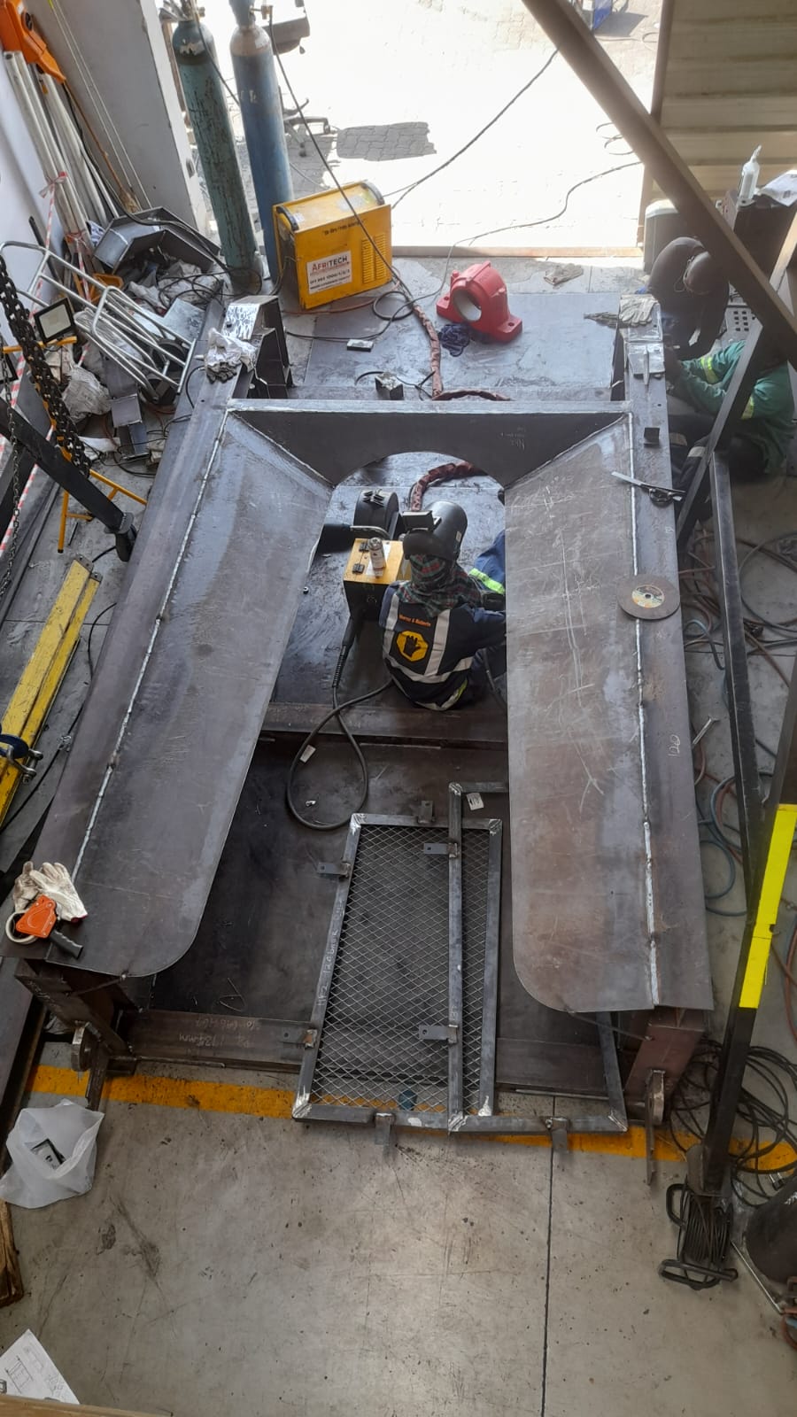 Welder working on large steel structure